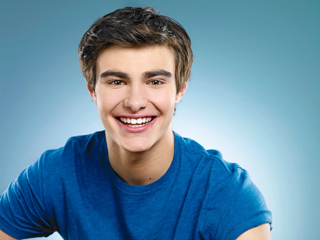 boy smiles with braces