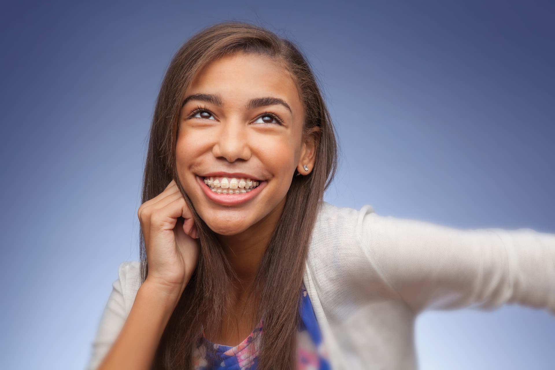 young boy smiles with braces